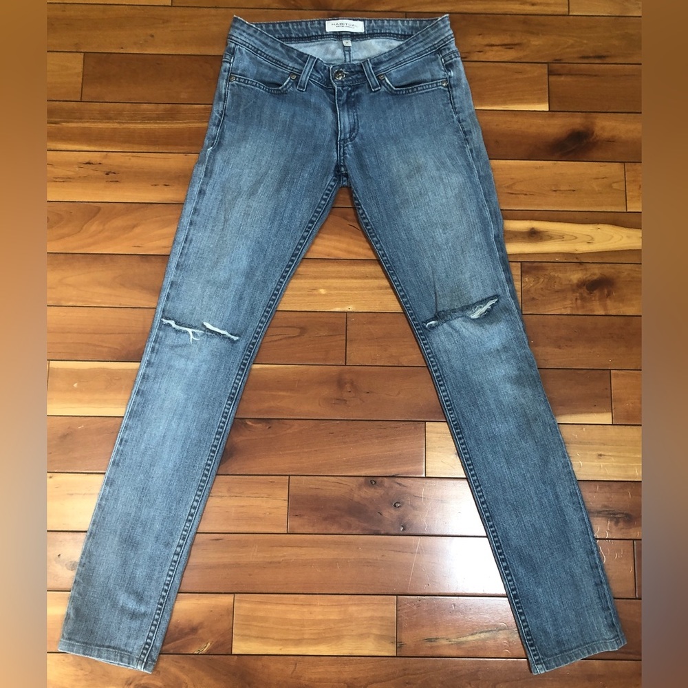 Habitual jeans. Size 26. Will stretch a tad. Knee holes. Acid rain wash.